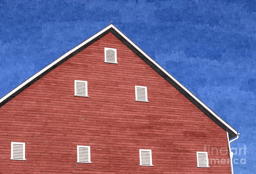 Side of a red barn creates triangle shapes against the blue sky Photograph by William Kuta