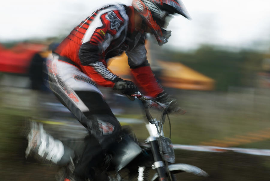 Side profile of a man on a racing bike Photograph by Glowimages