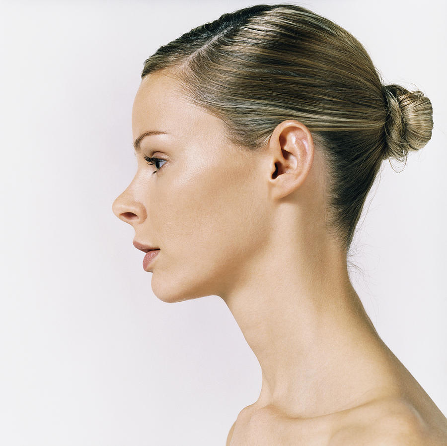 Side View of a Womans Head Photograph by Digital Vision.