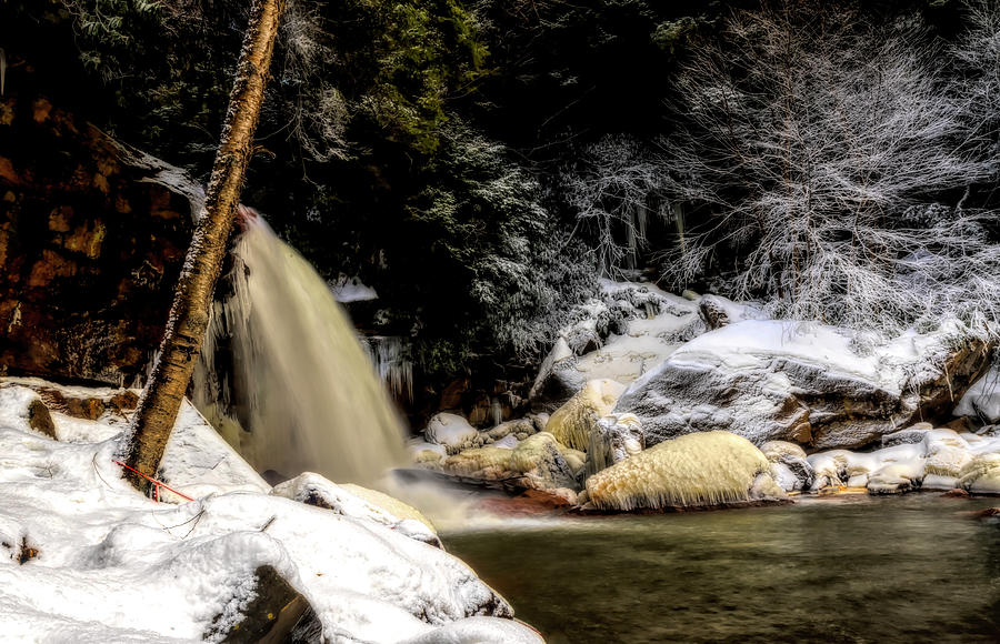 Side view of waterfall with snow covered ground Photograph by Dan Friend