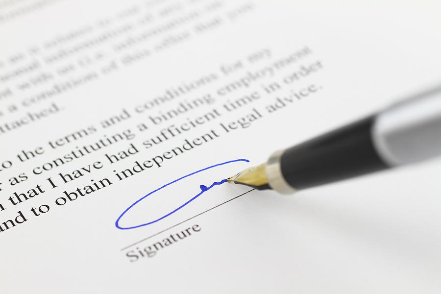 Signing contract Photograph by Barisonal