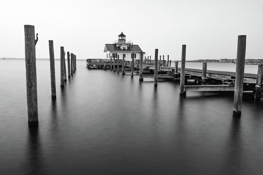 Black And White Photograph - Silent Sentinel - Echoes Of The Roanoke Marshes Lighthouse In Manteo - Black And White by Gregory Ballos
