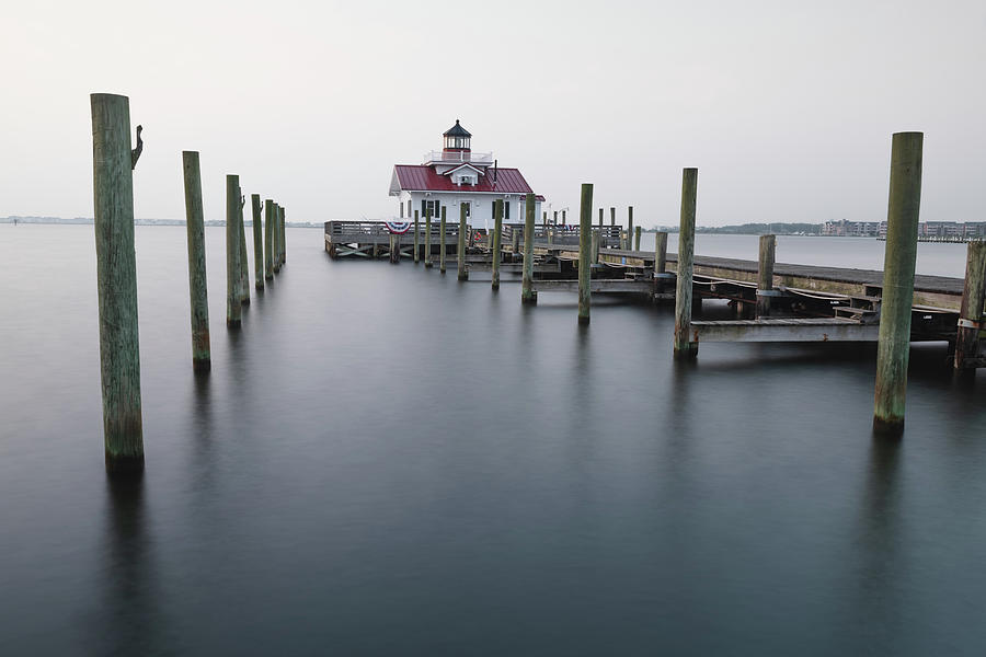 Nature Photograph - Silent Sentinel - Echoes Of The Roanoke Marshes Lighthouse In Manteo by Gregory Ballos