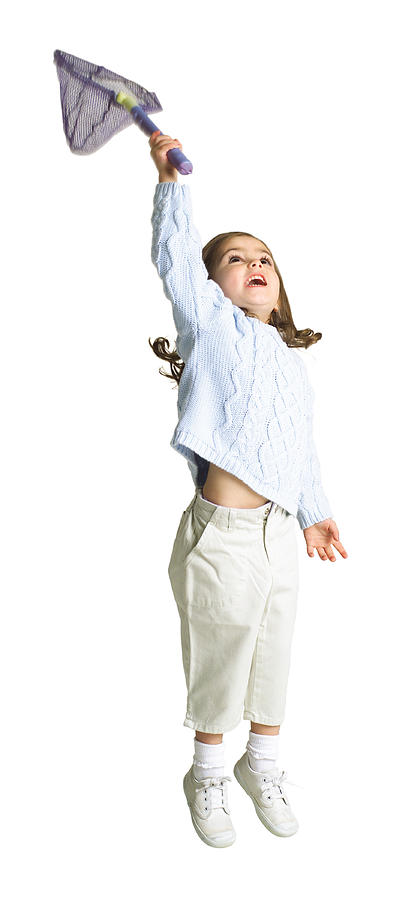 Silhouette Of A Caucasian Female Child With A Butterfly Net As She Playfully Jumps Up Photograph by Photodisc
