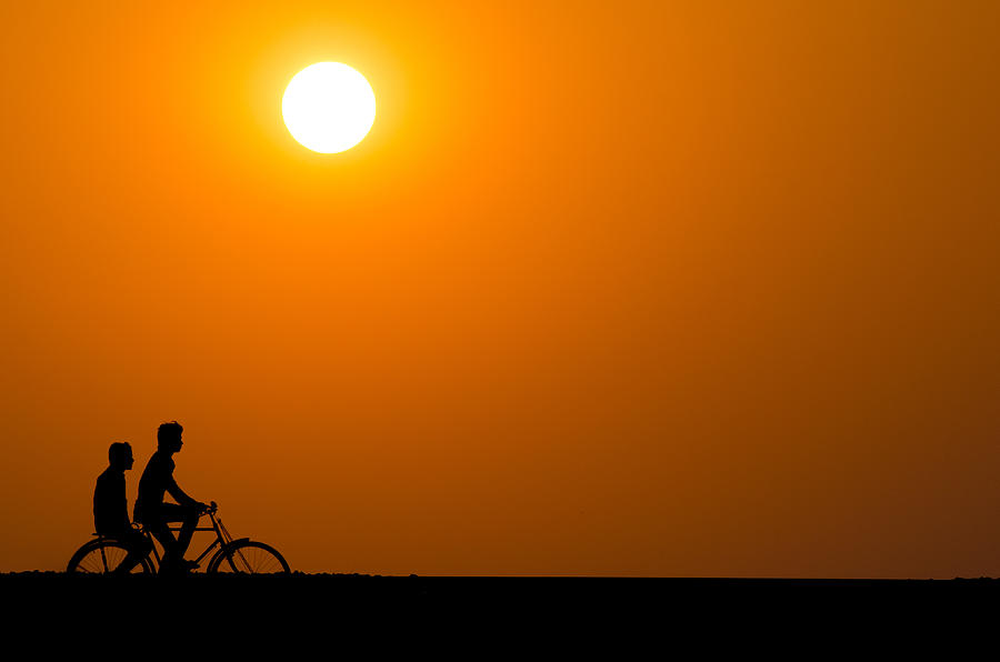 Silhouette of a cyclist men at sunset Photograph by Dilwar Mandal