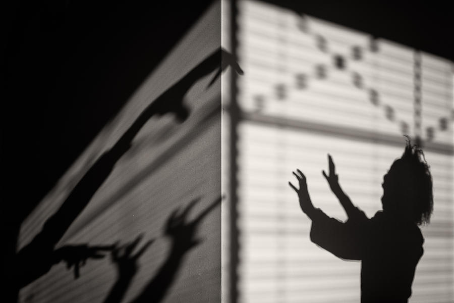 Silhouette of a scared girl with shadow monsters Photograph by Gloriasalgado