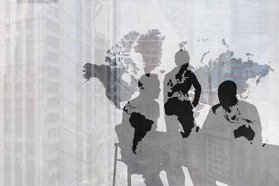 Silhouette of Caucasian business people near world map and cityscape Photograph by John M Lund Photography Inc
