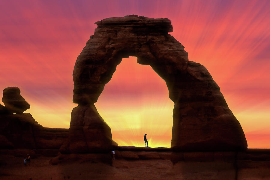 Silhouette of Delicate Arch Photograph by Mike McGlothlen