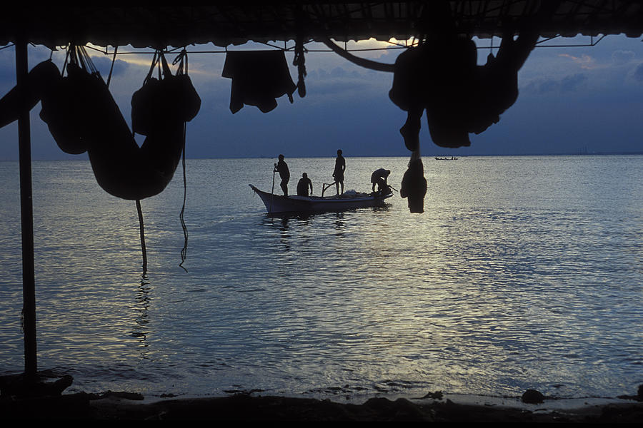 Silhouette of Fishermen on Boat at Sunrise Photograph by Brasil2