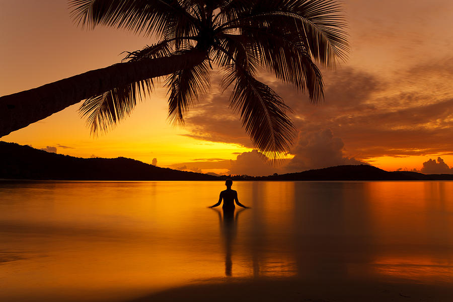 Silhouette Woman Meditating In Water During Sunset At A Beach Photograph by Cdwheatley
