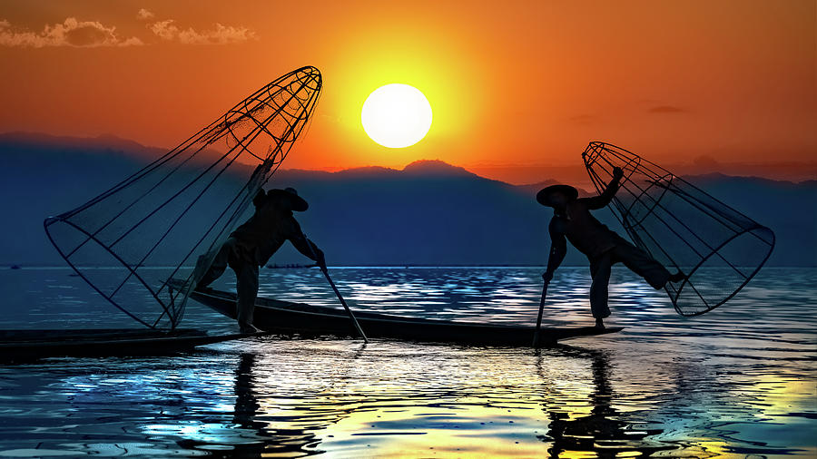 Silhouettes Of Burmese Fishermen Photograph by Chris Lord