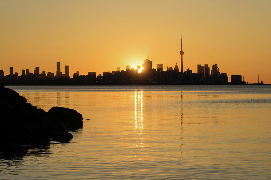 Silky Breeze and Sunshine - the Sun Rising Behind Toronto Distinctive Skyline Photograph by Georgia Mizuleva