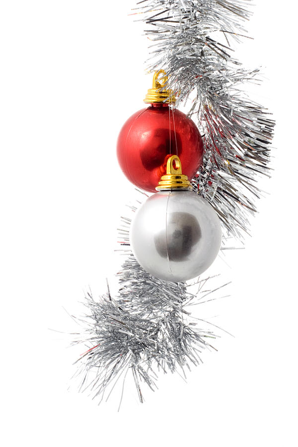 Silver and red ornament hanging from Christmas twine Photograph by Susan_Stewart