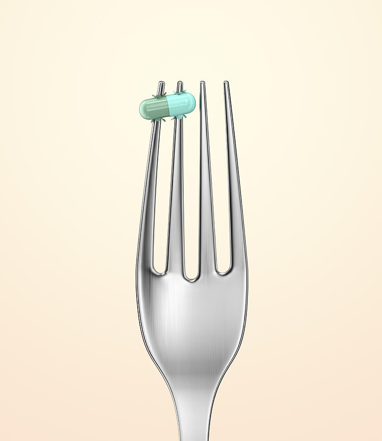 Silver fork with a pill spiked on a prong Photograph by I Like That One
