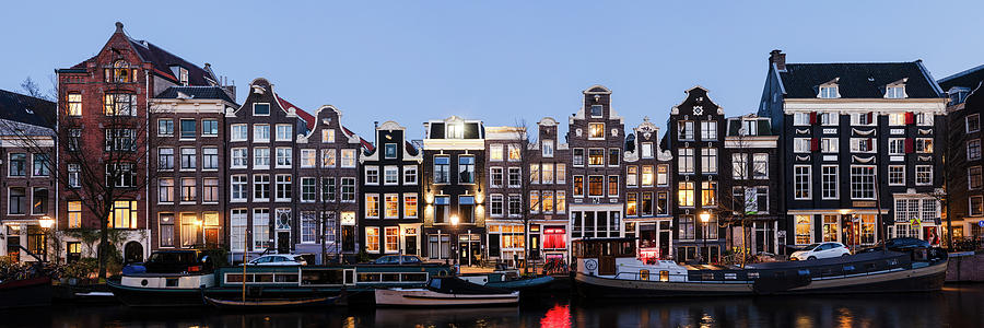 Singel Canal houses at night Amsterdam Netherlands Photograph by Sonny Ryse