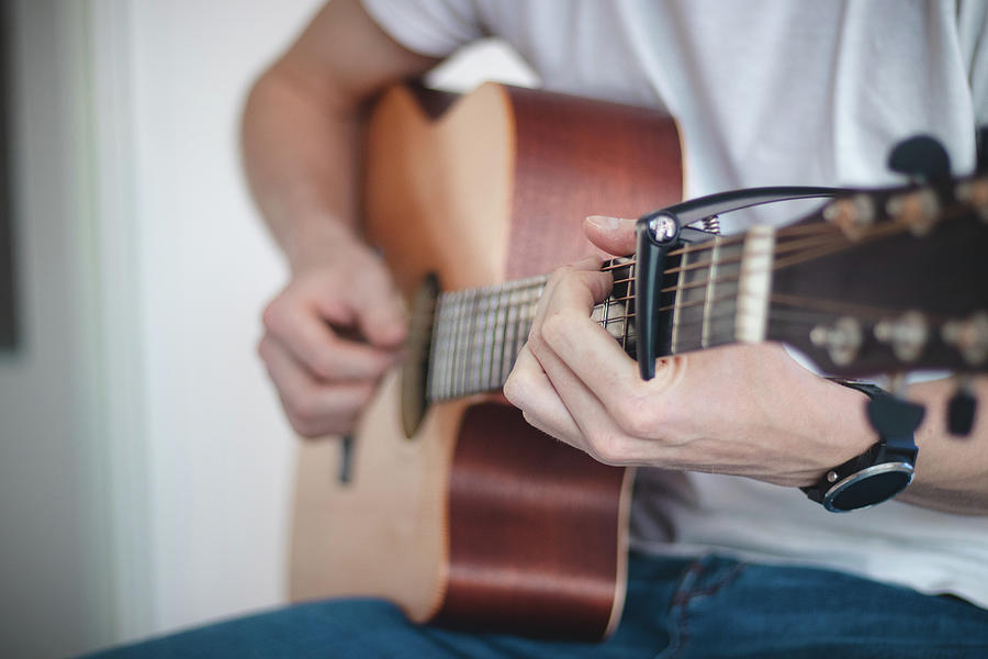Singer Playing On Guitar Photograph