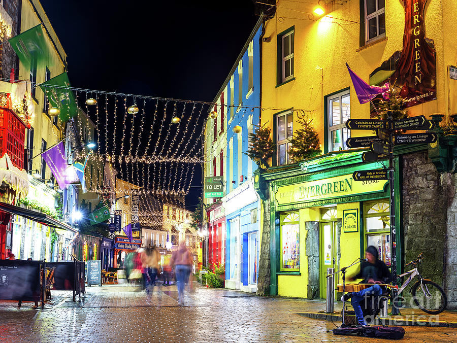 Singing at Night in Galway Photograph by John Rizzuto