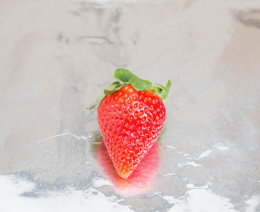 Single Strawberry on Foil Photograph by Dbvirago