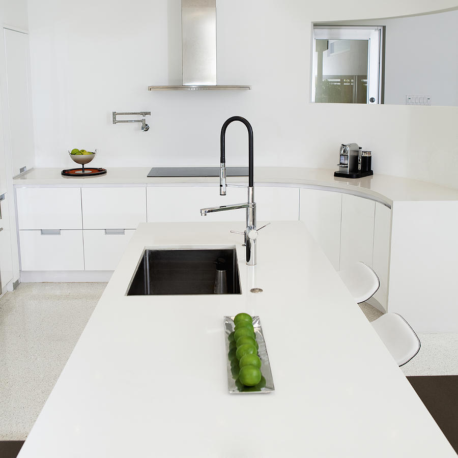 Sink, counter and stove in modern kitchen Photograph by Camilo Morales