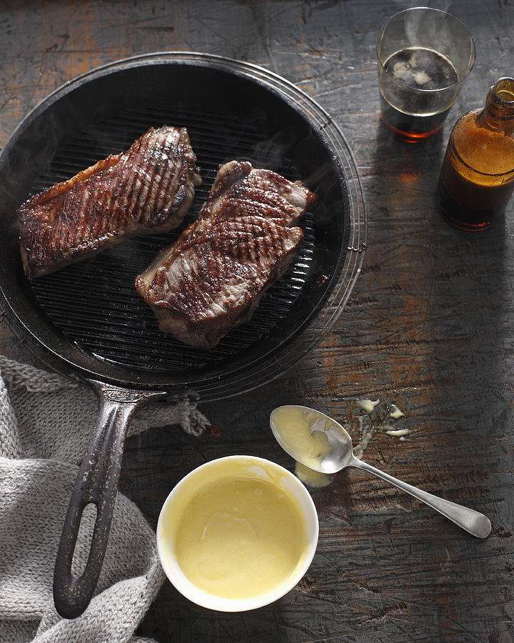 Sirloin steak in frying pan with bearnaise sauce Photograph by Brett Stevens