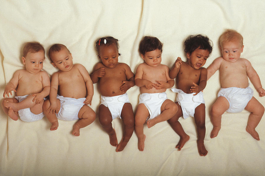 Six babies lying on blanket Photograph by Comstock