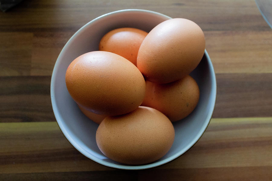 Six eggs stacked in a white bowl Photograph by Scott Lyons
