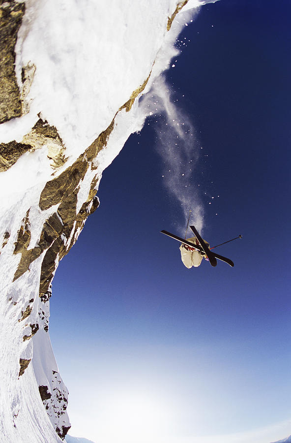 Skier Jumps From Rock Face, Coast Mountain, Whistler, British Columbia, Canada Photograph by Bryn Hughes Photography