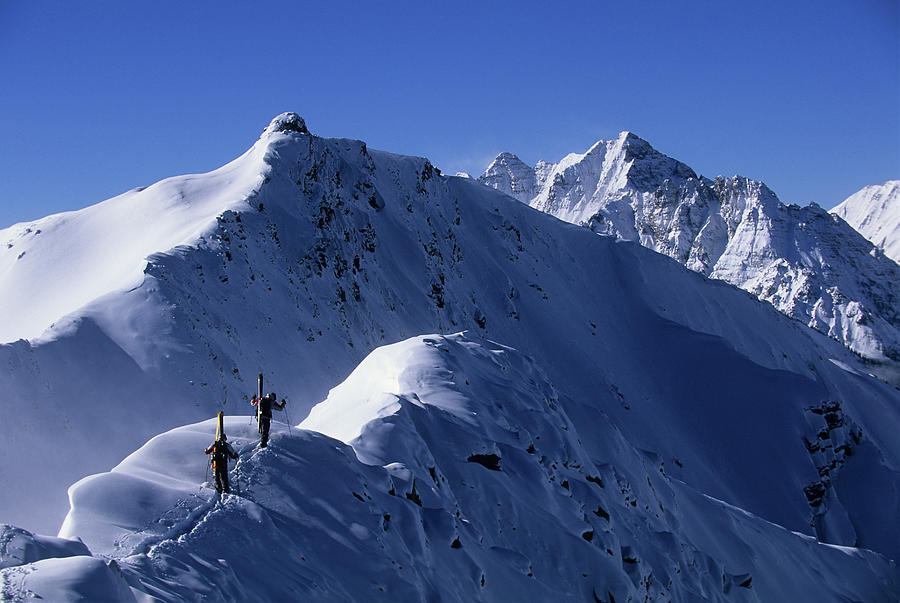 Skiers hiking ridgeline at Aspen Highlands, CO Photograph by Cavan Images Skiers hiking ridgeline at Aspen Highlands, CO Photograph by Cavan Images