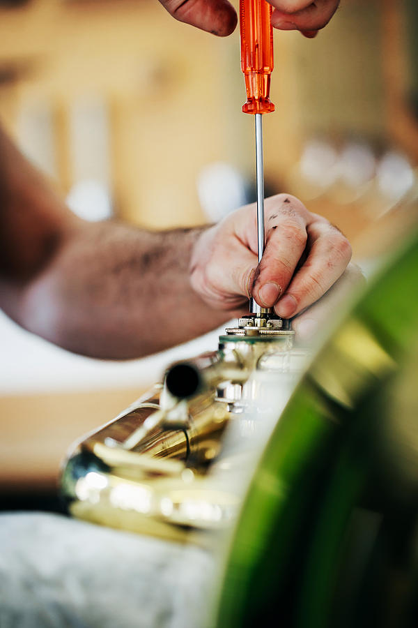 Skilled Craftsman Delicately Constructing Musical Instrument Photograph by Tom Werner