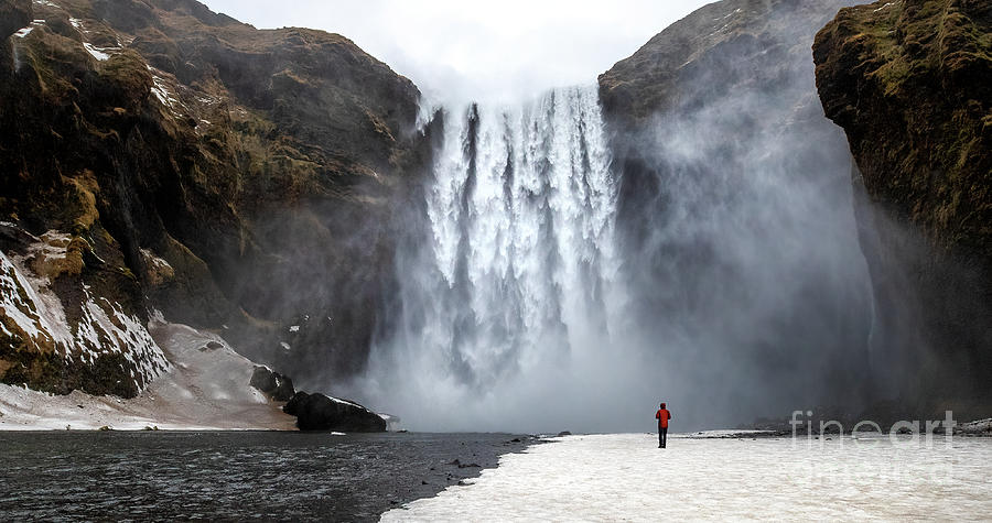 Skogafoss waterfall with solitary person Photograph by Jane Rix