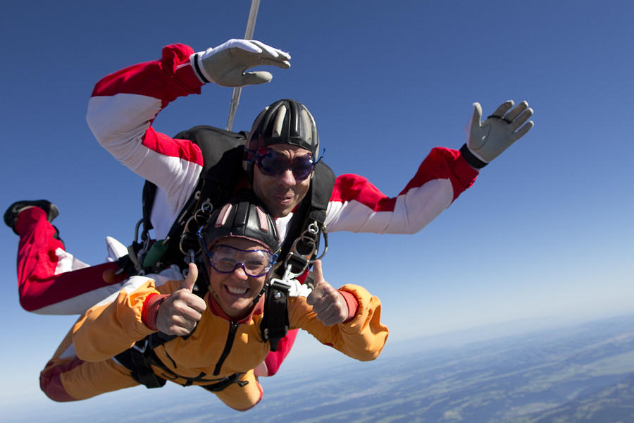 Skydive tandem passenger having a great time Photograph by Oliver Furrer
