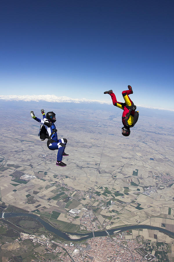 Skydive team playing in the sky together Photograph by Oliver Furrer