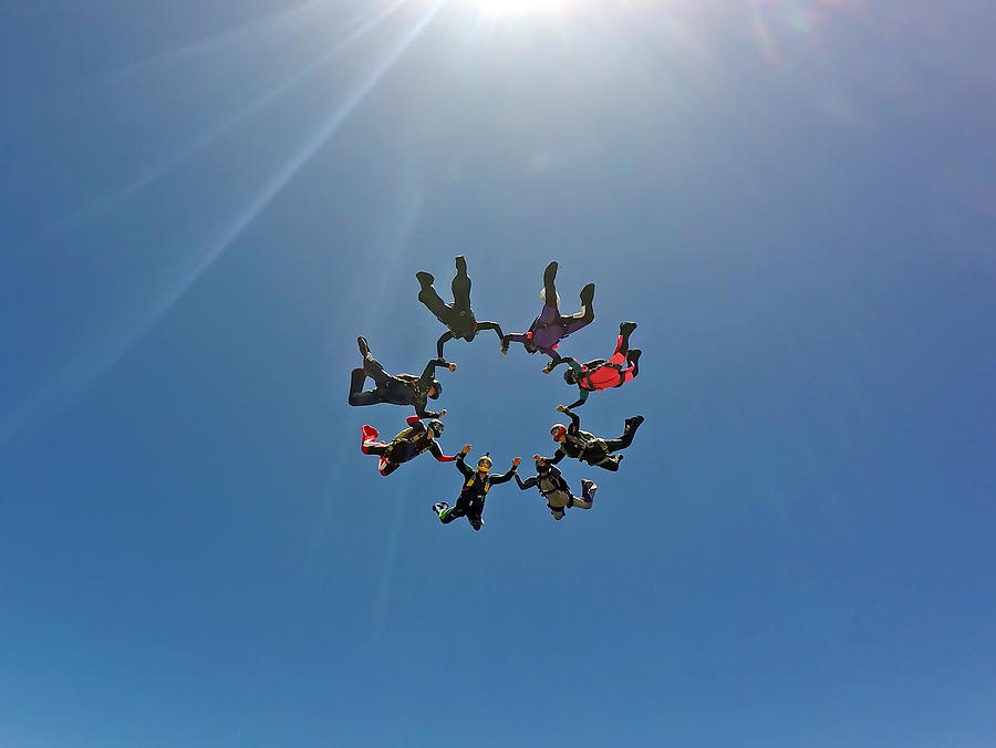 Skydiving group having fun Photograph by Graiki