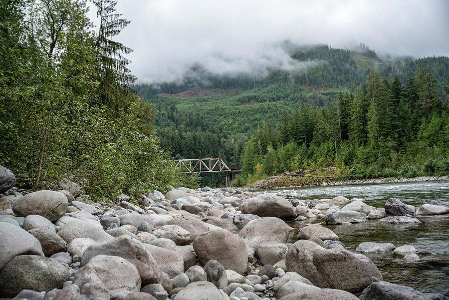 Skykomish River Rocks with Clouds Photograph by Tom Cochran
