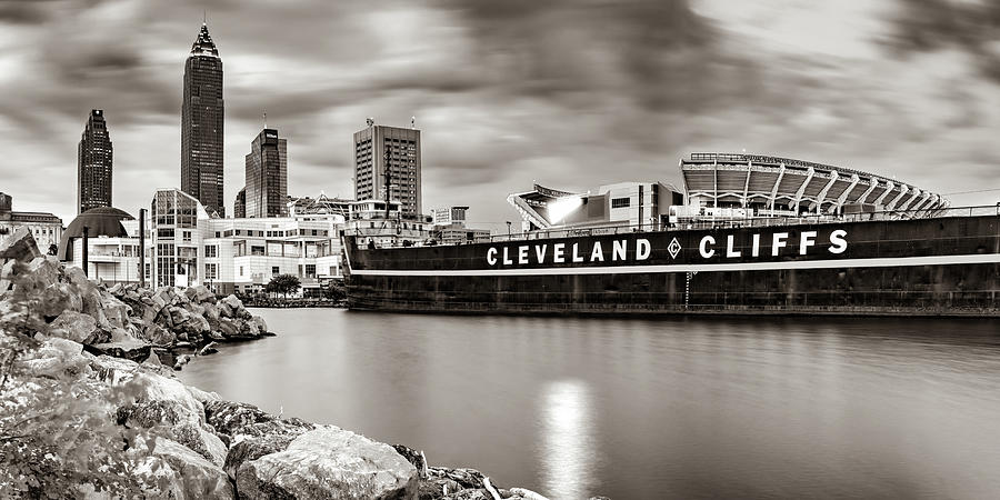 Skyline of Cleveland Ohio And Browns Stadium On Lake Erie Panorama - Sepia Photograph by Gregory Ballos