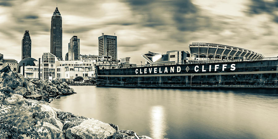 Skyline of Cleveland Ohio And Browns Stadium On Lake Erie Sepia Panorama Photograph by Gregory Ballos