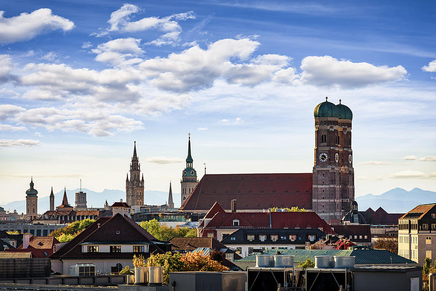 Skyline with Frauenkirche, St. Peter Church, New Town Hall and mountain range in the background, Munich, Bavaria, Germany Photograph by Harald Nachtmann