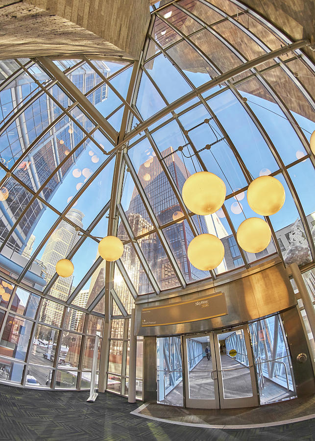 Taking in the light in a Minneapolis skyway Photograph by Jim Hughes