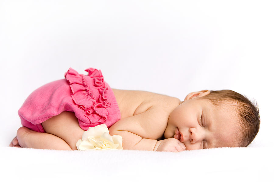 Sleeping newborn baby girl with white rose Photograph by Dlinca