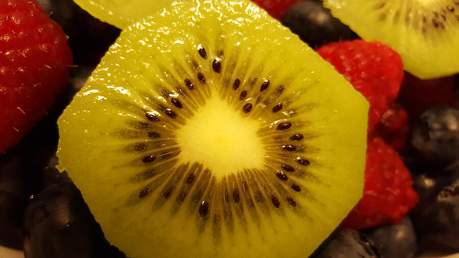 Slice of a kiwi Photograph by Deana Lee Andrew / Foap