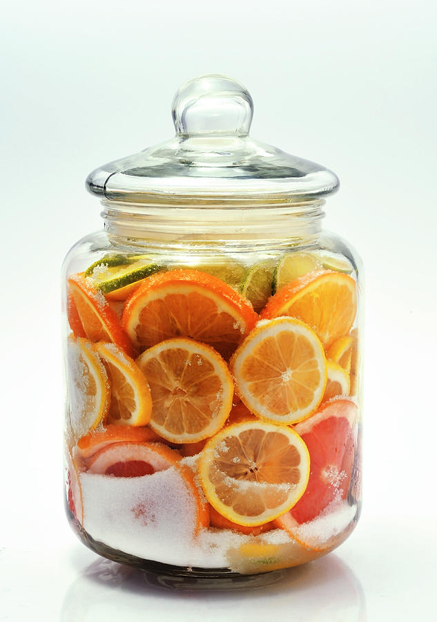 Sliced citrus fruits in a jar. Photograph by Madaland