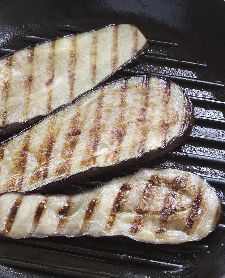 Sliced grilled aubergines close-up Photograph by Stuartpitkin