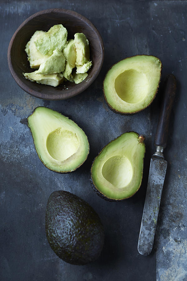Sliced, mashed and whole avocado Photograph by Cultura RM Exclusive/Danielle Wood