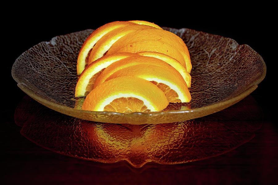 Sliced Orange on a Glass Plate Photograph by Ira Marcus
