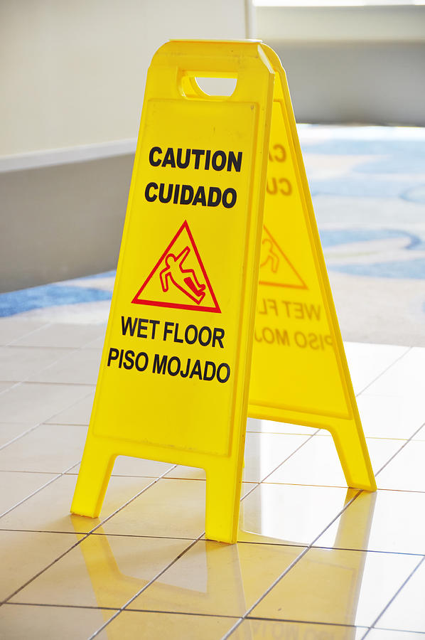 Slippery when wet sign Photograph by Dtimiraos