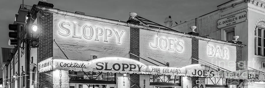 Sloppy Joes Key West Bar at Night Black and White Panorama Phot Photograph by Paul Velgos