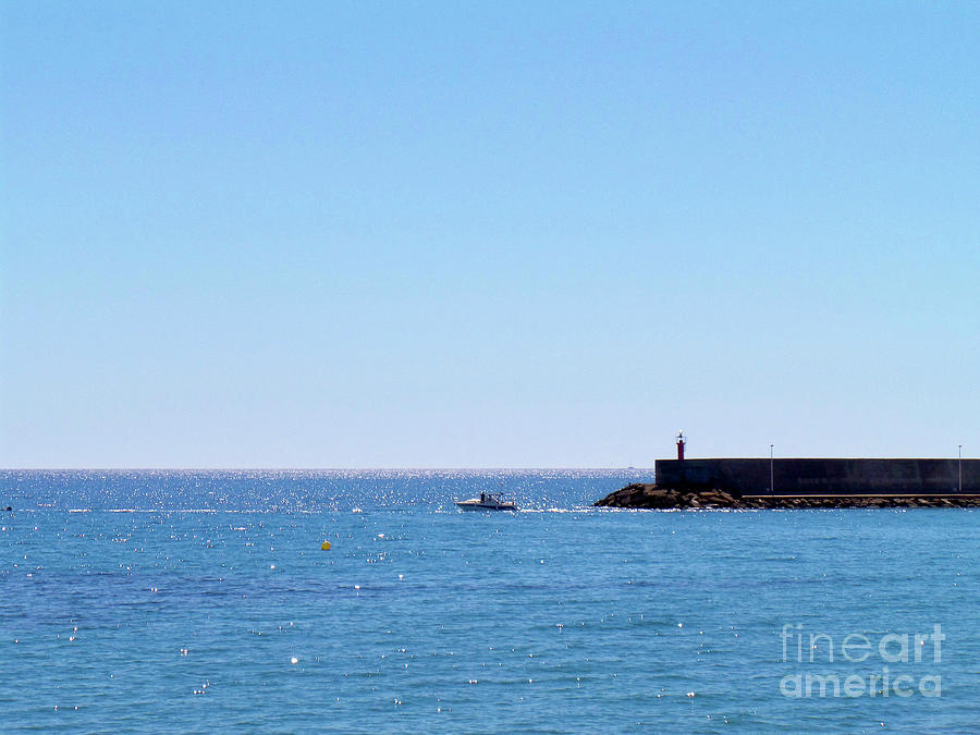 Small boat and Lighthouse, Almeria Photograph by Francesca Mackenney