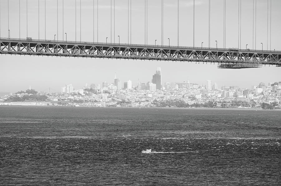 Small Boat and San Francisco Skyline under the Golden Gate Bridge Black and White Photograph by Shawn OBrien