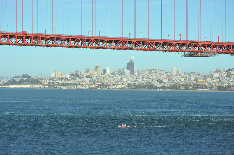 Small Boat and San Francisco Skyline under the Golden Gate Bridge Photograph by Shawn OBrien