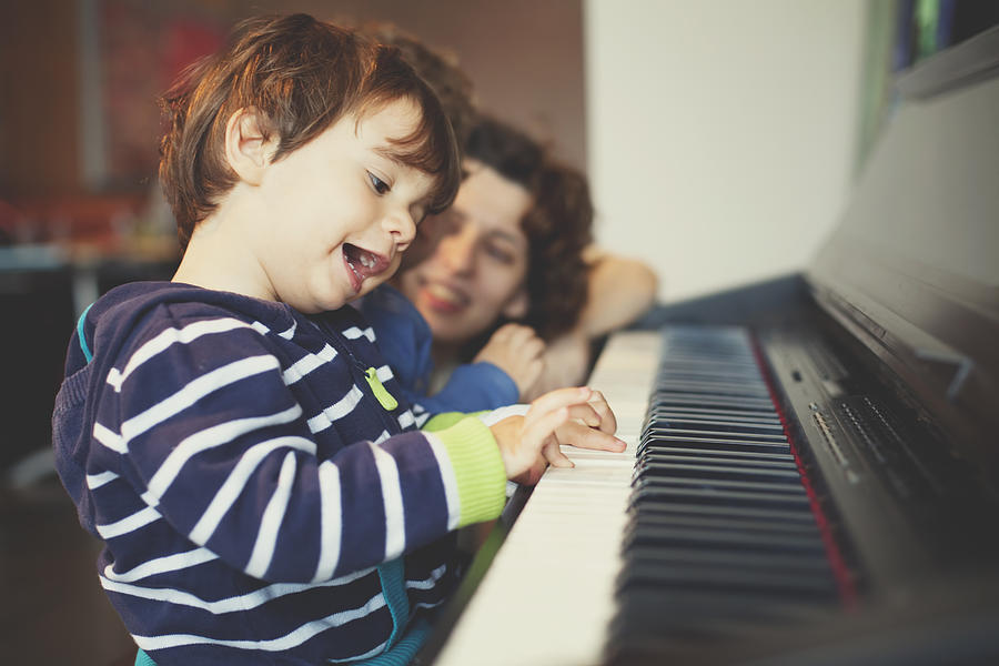 Small boy playing piano Photograph by Thanasis Zovoilis